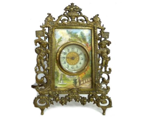 A 19th century brass framed mantel clock, with ivory surrounded painted with a garden scene, a/f, 17 by 24.5 by 12cm high. 