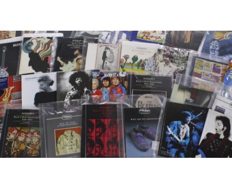 Large collection of rock memorabilia, guitar and entertainment memorabilia auction catalogues, some with auction result print