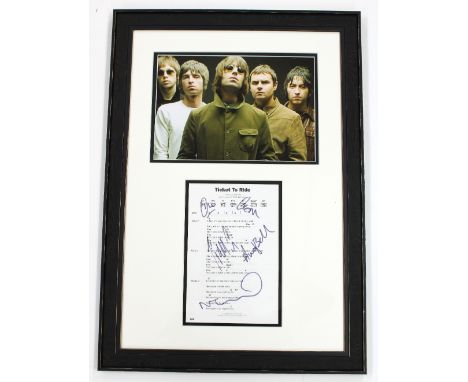 Oasis - autographed display bearing signatures on a 'Ticket to Ride' chord/lyric sheet, mounted and framed beneath a picture 
