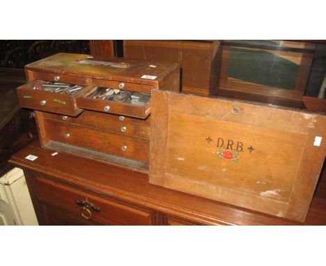 20th Century oak tool or collectors chest having slide out front revealing an arrangement of eight drawers, together with con