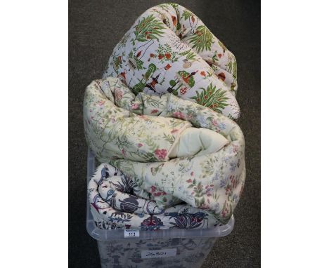 Box containing three vintage quilted bedspreads, one floral the other two decorated with plants, clocks etc. (3)(B.P. 21% + V