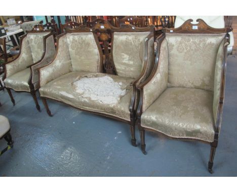 Edwardian rosewood inlaid parlour suite comprising; two seater sofa and a pair of wing back chairs, standing on tapering supp