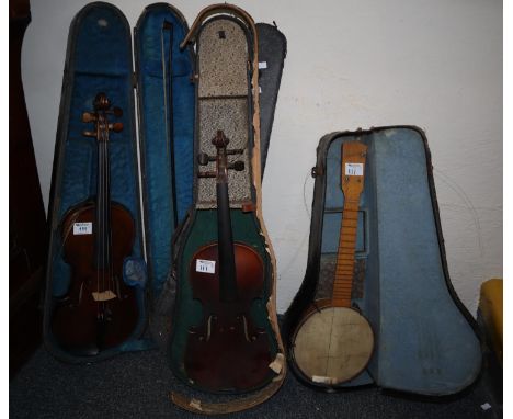 Antique violin with one piece back and scribed and inlaid outline, bearing label 'Carl Bergonzi 1733 Cremona' and a bow in ha