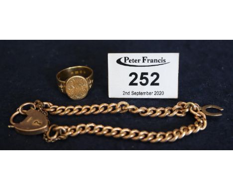 18ct gold engraved gentleman's signet ring (8.8g approx), together with a gold plated bracelet having 9ct gold padlock. (B.P.