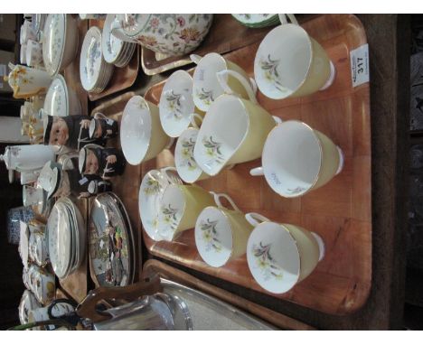16 piece Royal Albert bone china coffee set on a lemon ground, internally decorated with floral sprays, printed marks to the 