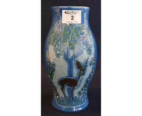 C.H. Brannam pottery Barnstaple Art Deco baluster pottery vase, overall decorated with stylised deer in a forest. Impressed m