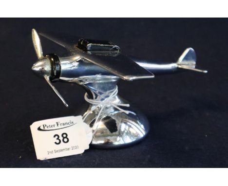 Novelty chrome plated American table lighter in the form of a vintage monoplane aircraft on circular pedestal base, the prope