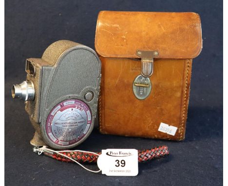 Bell & Howell-Gaumont 'Sportster' mechanical cine camera in leather carrying case with shoulder strap and light meter case. (