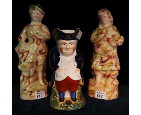 19th Century painted toby jug, together with two ceramic figurines. (3)(B.P. 21% + VAT) 