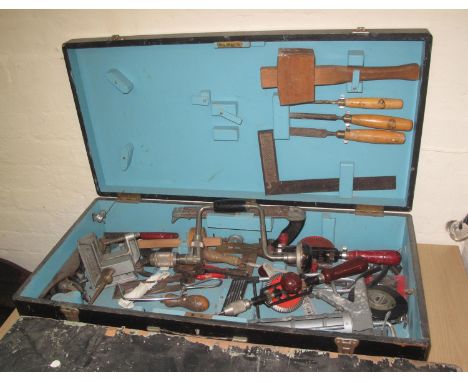 Two vintage wooden stained carpenters tool box, the interior revealing assorted tools, hammers, vices, drill pieces, chisels 