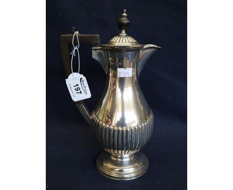 Silver baluster shaped half lobed coffee pot with ebony finial and handle. Sheffield hallmarks, 24cm high approx, 12 troy ozs