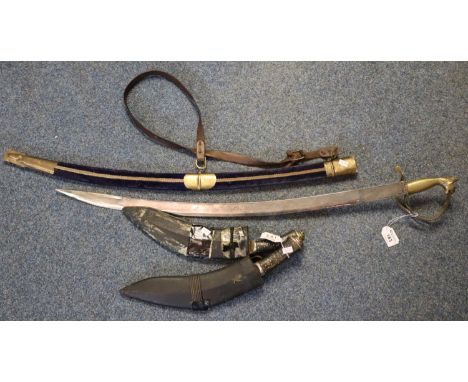 Two Indian made Nepalese style kukris with leather scabbards, together with an Indian brass mounted ceremonial sword with vel