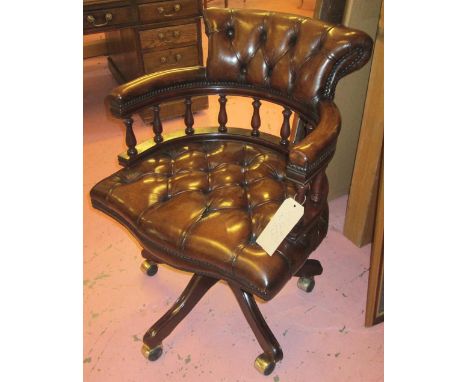 REVOLVING DESK CHAIR, tan leather upholstered with deep button back and seat revolving and reclining on an adjustable base wi