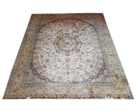 VERY FINE SILK KAYSERI CARPET, 301cm x 245cm, pendant medallion with spandrels, palmettes and vines on an ivory field within 