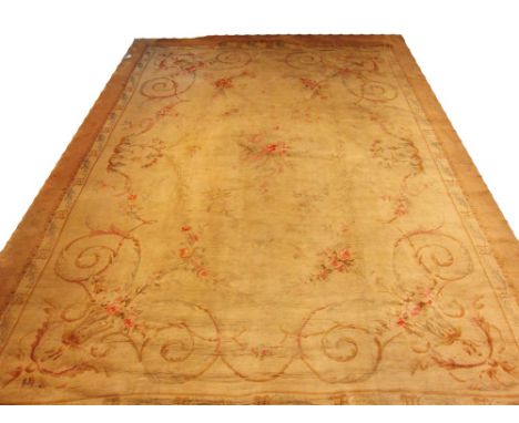 AUBUSSON STYLE CARPET, 561cm x 396cm, cartouche medallion with a floral border on an ivory field within gold bands and border