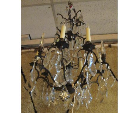CHANDELIER, en suite with previous lot, patinated metal with six lighting arms, hung with faceted glass drops, approx 75cm H.