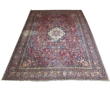 ANTIQUE DOROSH CARPET, 365cm x 265cm, central medallion surrounded by scrolling vines, leaves and palmettes with a midnight b