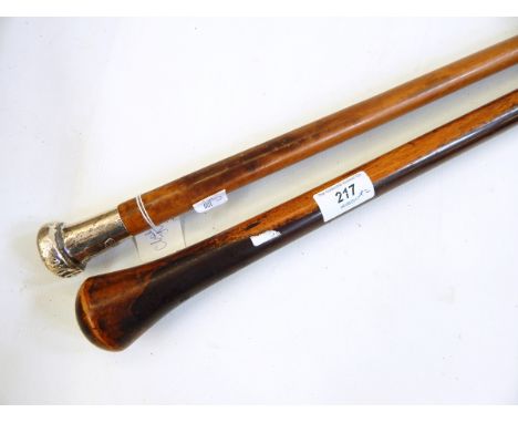 Malacca walking cane with silver finial bearing the crest for the Wiltshire Regiment and a lignum vitae walking stick (2) 