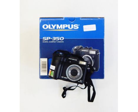 Olympus SP350 digital compact camera with its original box, accessories, manual, a Canon Z70W Sureshot camera and a box of le
