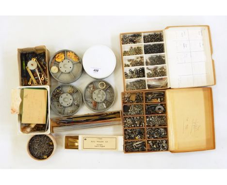 Quantity of screws, watch and clock parts, brass cogs, clock hands and small watch parts 