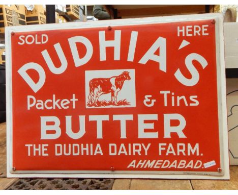 Enamel sign "Dudhia's Packet Butter...", the Dudhia Dairy Farm, the metal sign has been screwed onto a wooden base, 33cm x 50