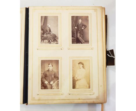 Victorian embossed leather musical photograph album and contents of portrait photographs, with music box mechanism to the bac