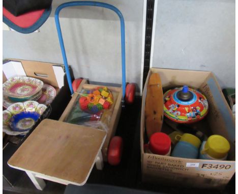 A collection of toys, to include a Chad Valley spinning top, a trolley with bricks, flasks etc