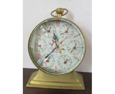 A brass cased World Time mantel clock, with Roman numerals, height 12ins