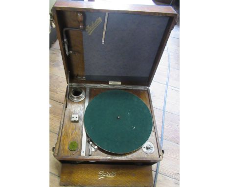 A Dulcetto portable record player, together with records