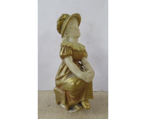 A Royal Worcester gilded ivory Kate Greenaway figure, of a seated girl, model number 901, height 4ins