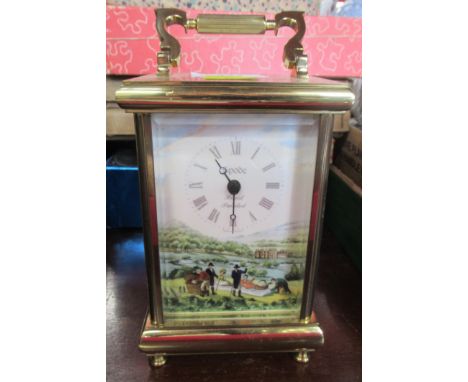 A brass carriage clock, with Spode porcelain panels