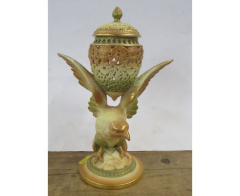A Royal Worcester blush ivory pot pourri, formed as a bird supported the covered vase, model number G11, height 9ins
