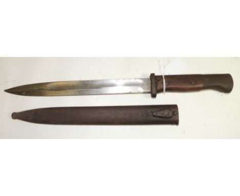 A German bayonet having wood grip, single edged blade with deep fuller and in original metal scabbard. blade 25cms long