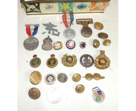 A WWI silver War Badge numbered; two Womens Land Army metal badges; silver ARP badge; brass Marines cap badges; US brass butt