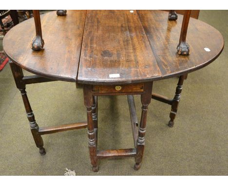 An 18th century oak gate leg dining table of small proportions 111cm 89cm by 69cm  