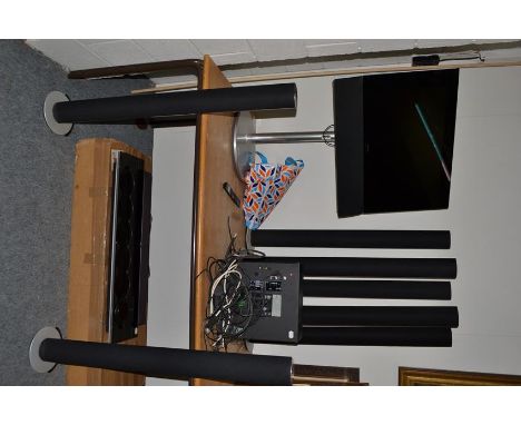 A Bang and Olufsen media setup comprising a Beo vision 6-26, a Beo system 2, a Beo 900 CD player with stand together with sev