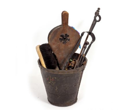 A VICTORIAN LEATHER FIRE BUCKET and a small quantity of fire tools to include bellows