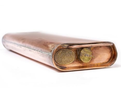 A COPPER AUTOMOBILE HOT WATER WARMER with looping handle, brass end cap and pressed instruction plate, 56.5cm wide x 8cm high