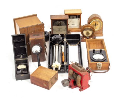 A GROUP OF VARIOUS WOODEN CASED METERS together with an old electric motor and a Russian air temperature thermometer with clo