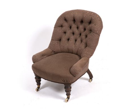 A VICTORIAN BUTTON UPHOLSTERED NURSING CHAIR with turned front legs terminating in brass and ceramic casters, 64cm wide x 63c