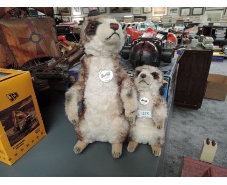 Two modern Steiff Meerkats, 071249 Mungo, height 30cm and 045257 Cockie, height 20cm, both with white circulat tags and yello