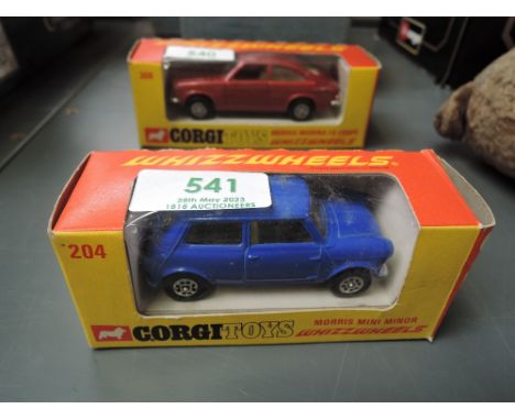 A Corgi Toys Whizz Wheels diecast, 204 Morris Mini minor 1.8 in dark blue with cream interior, in original box