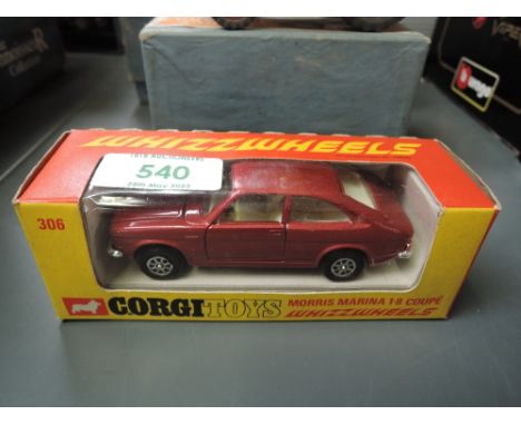 A Corgi Toys Whizz Wheels diecast, 306 Morris Marina 1.8 Coupe in red with cream interior, in original box