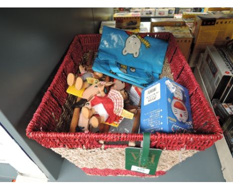 A modern wicker basket containing two modern Steiff Macki and Mucki Hedgehogs both with yellow ribbons and original tags, rep