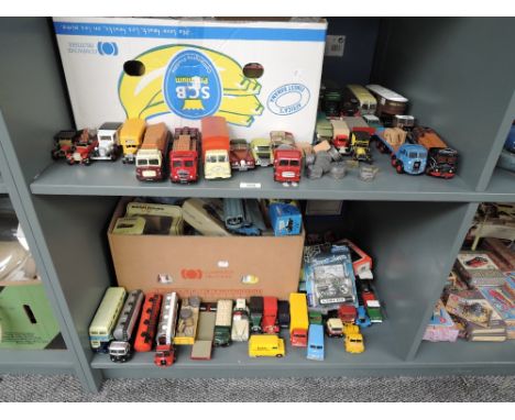 Two shelves of Corgi and similar diecasts, Trucks, Cars, Wagons, Buses etc, mainly Classics, boxes present but not together w