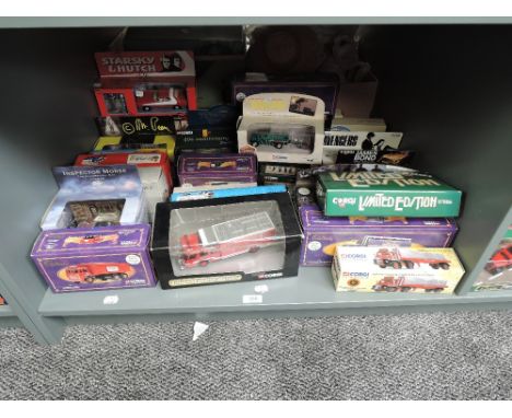 A shelf of Corgi Limited Edition and similar diecasts including Starsky &amp; Hutch, Cadbrury, James Bond, Brewery, all boxed