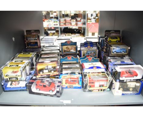 A shelf of modern diecasts inclyuding Burago, Oxford, Maisto, New Ray and similar, all boxed approx 60+