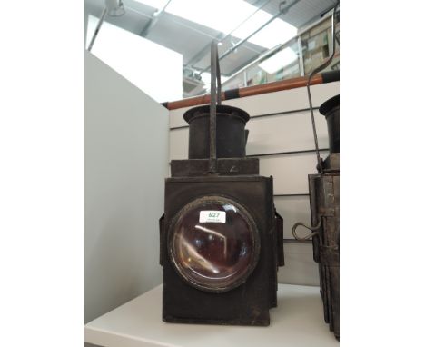 A Railway Lamp having front and rear bulls eye lens and carry handle, no marking seen, height including handle 45cm