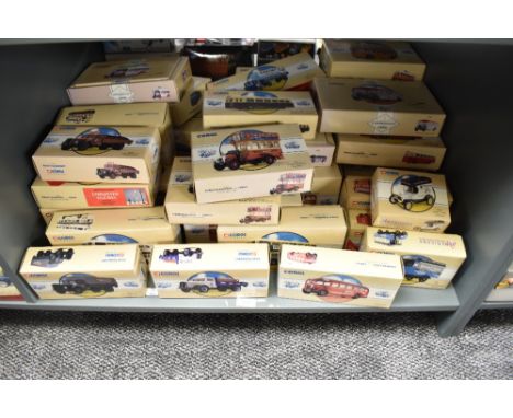 A shelf of Corgi Classics diecast Buses and Advertising Vans, all boxed, approx 40+