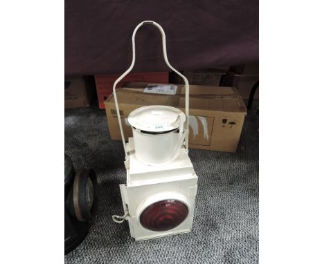 A BR (W) Railway Lamp having original bulls eye lens and carry handle, painted white, height including handle 52cm